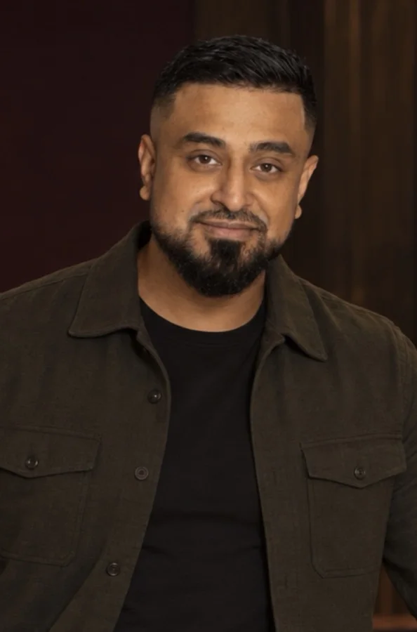 Portrait of Omid Romal in a dark overshirt