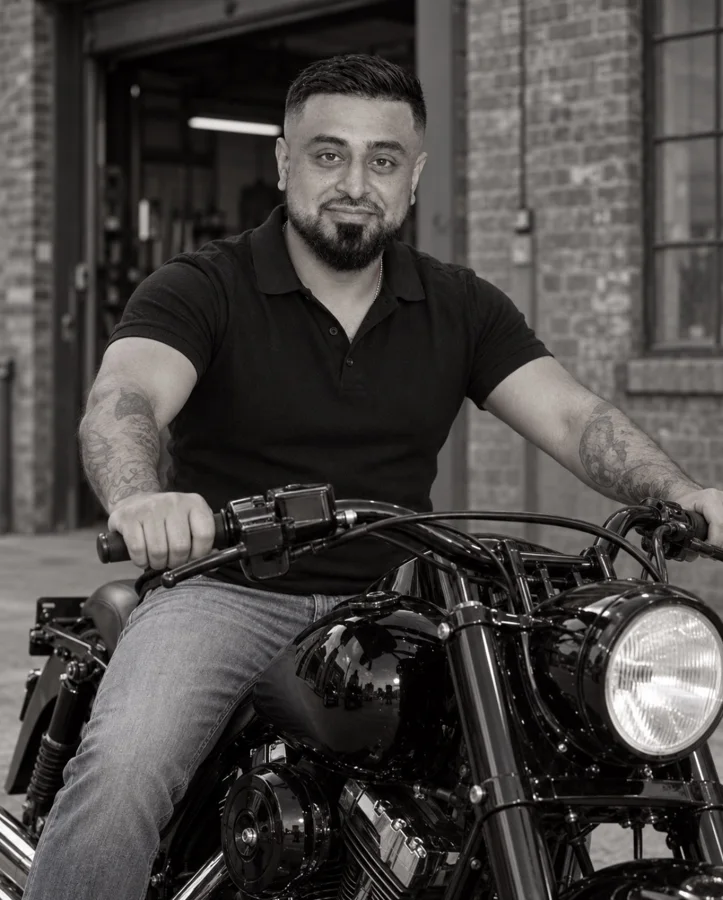 Omid Romal seated on his Harley-Davidson motorcycle