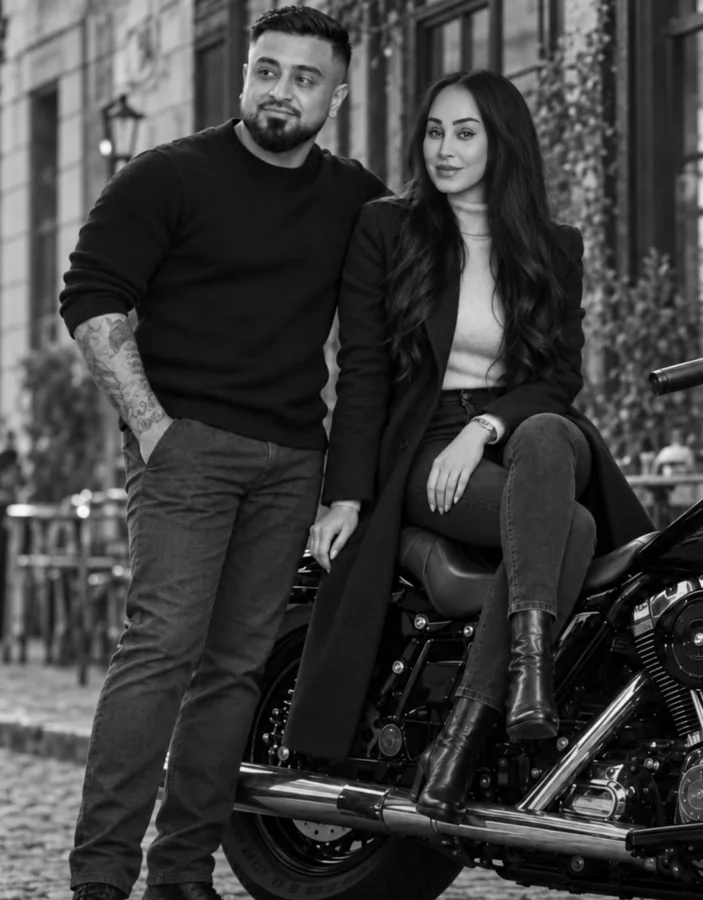 Omid Romal and Huda beside a motorcycle in the city